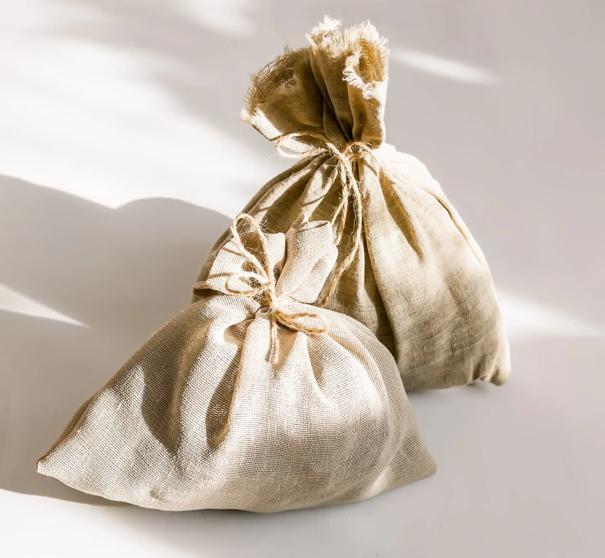 The filter packed in an open cosmetic pouch alongside a comb and cotton pads.